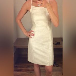 Shimmery ivory cotton cocktail dress with gold threading.